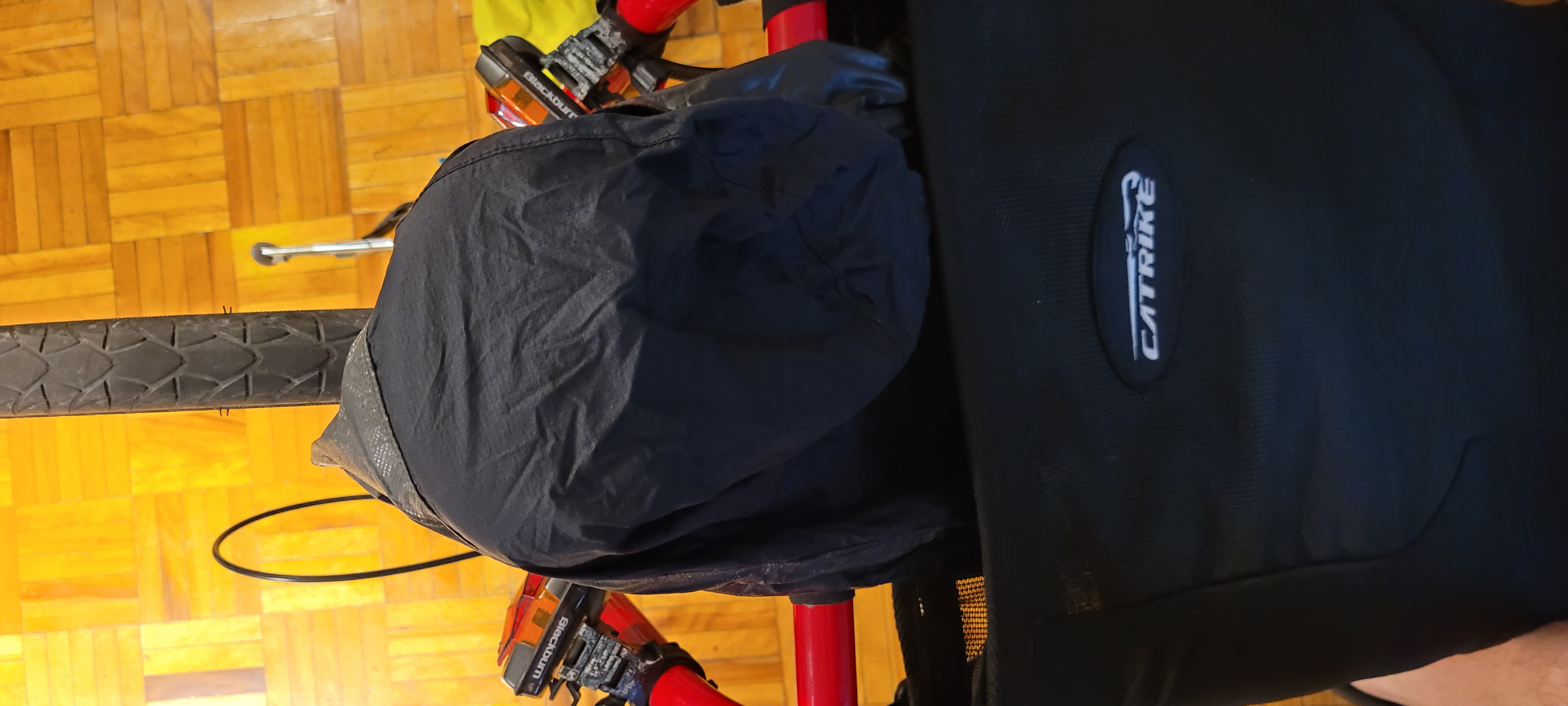 Rain jacket stuffed into seat and hood draped over headrest